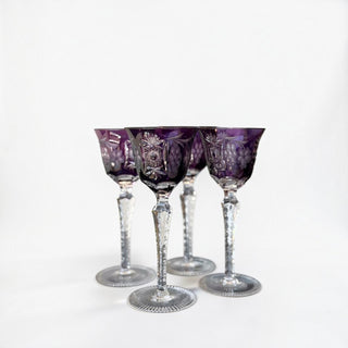 Her Good Eye set of 4 Nachtmann Traube amethyst hock wine glasses with hand-cut crystal patterns and hexagonal stems.