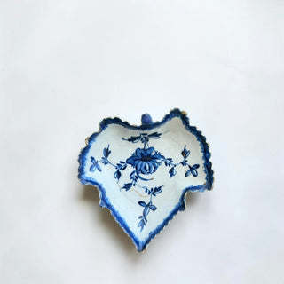 Her Good Eye antique blue and white floral leaf-shaped ceramic trinket dish with gilded edge.