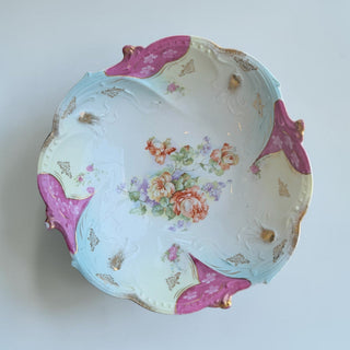Her Good Eye antique porcelain serving bowl with floral motif, pastel blue, creamy white, magenta accents, and gold detailing.