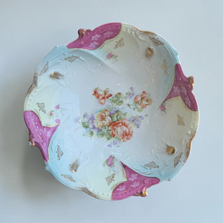 Her Good Eye antique porcelain serving bowl with floral motif, scalloped rim, and gold detailing. Pastel blue and magenta glaze.