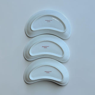 Her Good Eye antique kidney-shaped porcelain serving dish with floral accents and vine border.