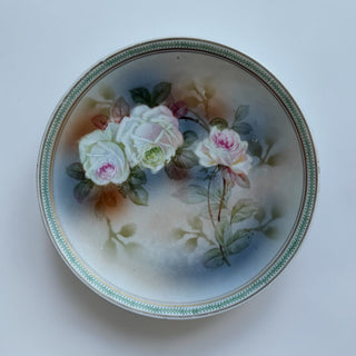 Her Good Eye antique porcelain plate with hand-painted white and pink roses, green and gold border.