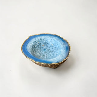 Her Good Eye blue agate coaster with gold electroplated edge, showcasing natural crystalline formations and blue banding.