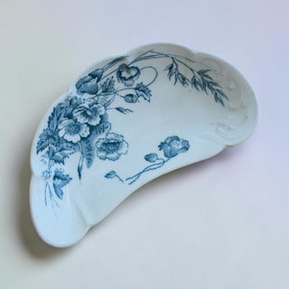 Her Good Eye blue and white floral ceramic serving dish with scalloped edge and embossed detailing.