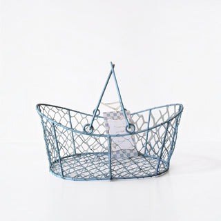 Her Good Eye dusty blue oval wire gathering basket with hinged handles and rustic farmhouse style.