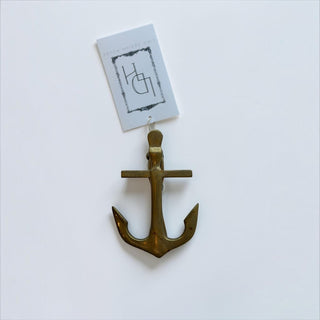 Her Good Eye brass nautical anchor clip with a spring mechanism and Lido Design House tag on a white background