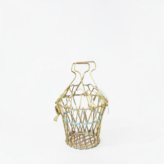 Her Good Eye vintage-inspired brass-toned metal wire basket with an intricate lattice design and top handle.