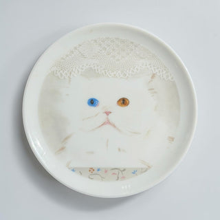 Her Good Eye decorative ceramic plate featuring a fluffy white cat with one blue and one amber eye and lace detail.