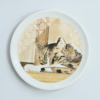Her Good Eye ceramic collector plate featuring a tabby cat illustration with lace detail in a warm color palette.