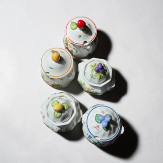 Her Good Eye decorative ceramic jam jar with fruit and floral design, featuring a lid with fruit knob and ornate handles.