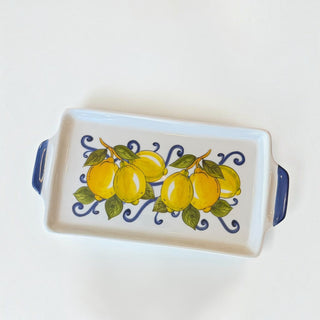 Her Good Eye rectangular ceramic serving tray with hand-painted yellow lemons and navy blue flourishes.