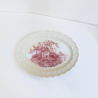 Her Good Eye vintage ceramic oval serving platter with cranberry castle transferware design and scalloped edges.