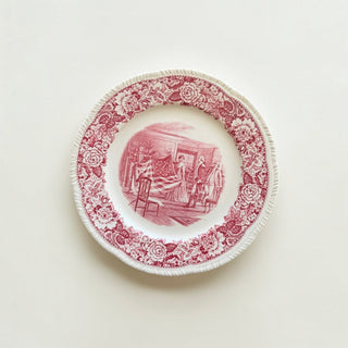 Her Good Eye vintage-style ceramic dinner plate with a cranberry red historical scene and embossed rose border.