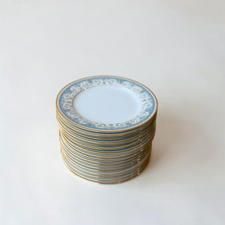 Her Good Eye decorative porcelain dinner plate with sky blue floral trim and gold rim. Stack of 12 plates.