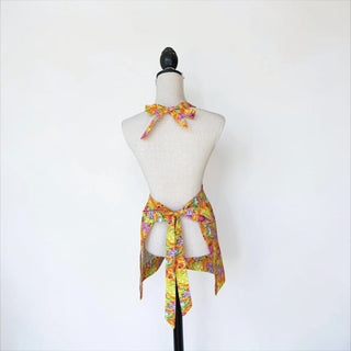 Her Good Eye yellow floral deer print kitchen apron with adjustable tie straps and a bow detail.