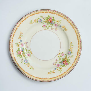 Her Good Eye cream ceramic dinner plate with vintage floral pattern and gold rim. Features pink roses, bluebells, yellow blossoms.