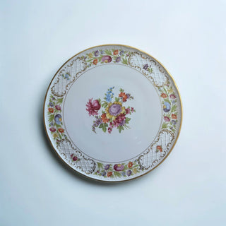 Her Good Eye decorative porcelain serving platter with hand-painted floral bouquet and gold scrollwork border.