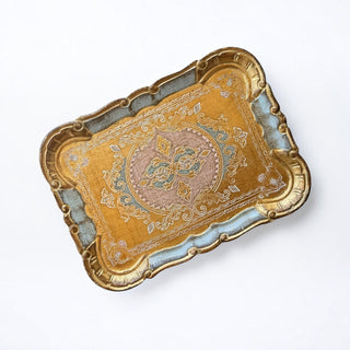 Her Good Eye handcrafted Florentine serving tray with distressed gold finish, blue and pink floral motifs, and scrollwork.