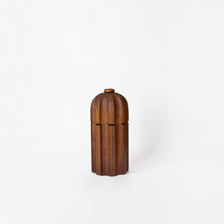 Her Good Eye handcrafted walnut wood spice grinder with a sophisticated fluted texture and ergonomic design.