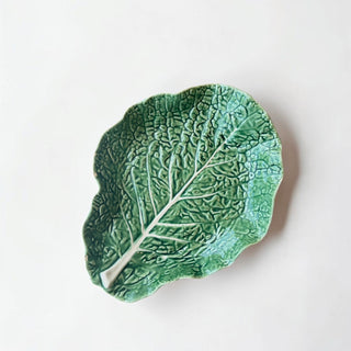 Her Good Eye green ceramic leaf shaped serving dish with realistic veining and textured surface.