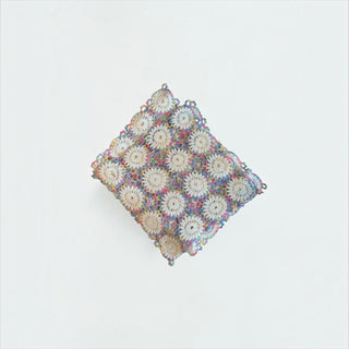 Her Good Eye handmade cream and multi-colored variegated crochet doily with intricate circular motifs.
