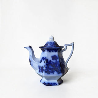 Her Good Eye vintage hexagonal ceramic teapot in blue and white floral transferware pattern with a matching lid.