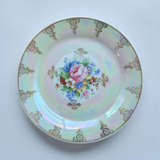 Her Good Eye iridescent floral decorative plate with hand-painted roses and gold rim detail. Pearlescent finish with pink, green, and blue hues.