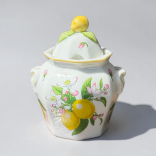 Her Good Eye white ceramic sugar bowl with lid, decorated with lemon blossoms, lemons, and pink buds.