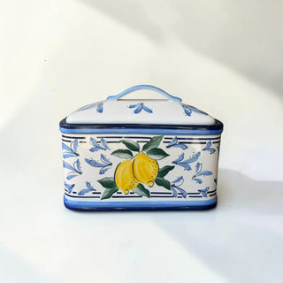 Her Good Eye ceramic rectangular bread box with hand-painted yellow lemons and blue scrollwork pattern.