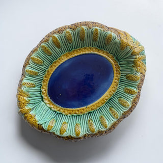 Her Good Eye ornate ceramic decorative serving dish with cobalt blue center, mint green and gold border, and brown exterior.