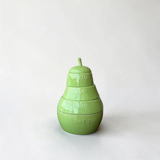 Her Good Eye green ceramic pear-shaped measuring cup set with embossed measurements.