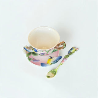 Her Good Eye porcelain tea cup and saucer set in pastel pink with 3D blue tit, berry motifs, and branch-style handle.