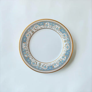Her Good Eye decorative porcelain dinner plate with sky blue floral trim and gold rim.