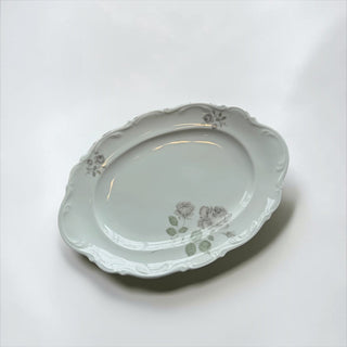 Her Good Eye vintage porcelain oval serving platter with grey rose floral motifs and embossed scalloped edges.