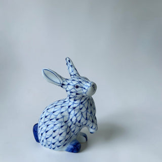 Her Good Eye porcelain rabbit figurine with hand-painted blue fishnet pattern on white glossy ceramic.