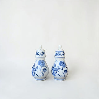 Her Good Eye porcelain salt and pepper shakers with blue and white floral patterns and a glossy pear-shaped design.