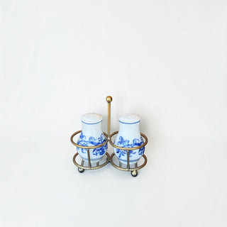 Her Good Eye vintage porcelain salt and pepper shakers with blue floral pattern in an antique brass metal caddy