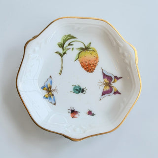 Her Good Eye white porcelain trinket dish with gold rim, strawberry, butterfly, and ladybug botanical illustrations.