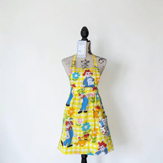 Her Good Eye yellow gingham Raggedy Ann & Andy apron with floral accents and pocket. Adjustable ties.