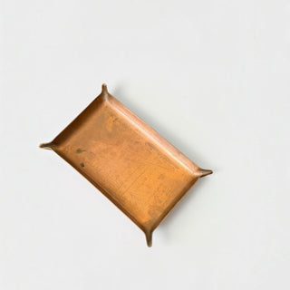 Her Good Eye rectangular copper catchall tray with raised corner details on a white background.