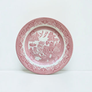 Her Good Eye crimson red ceramic dinner plate featuring a traditional Chinoiserie Willow pattern with intricate details.