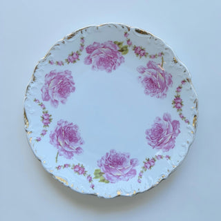 Her Good Eye decorative white porcelain plate with pink roses and gold trim, scalloped edge.
