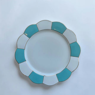 Her Good Eye scalloped edge dinner plate in white and turquoise with geometric design and gold rim. Ceramic.