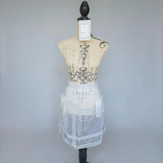 Her Good Eye vintage style sheer white organza half apron with delicate lace hem and front pockets on a mannequin