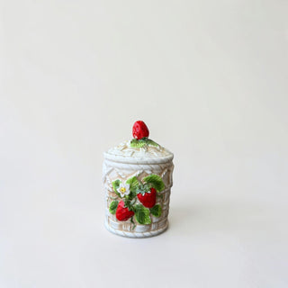 Her Good Eye strawberry basket ceramic storage jar with lid, featuring embossed basketweave design and 3D strawberries.