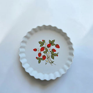 Her Good Eye white ceramic pie plate with fluted edge and strawberry vine pattern