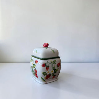 Her Good Eye white ceramic trinket dish with lid, hand-painted strawberry pattern, green trim, and red berry knob.