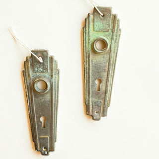 Her Good Eye vintage Art Deco door plates in weathered bronze and verdigris with geometric 1920s design and keyholes.