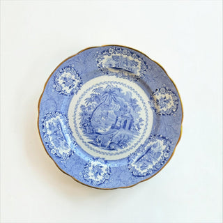 Her Good Eye vintage blue and white porcelain dinner plate with pastoral scene, floral motifs, and gold scalloped edge