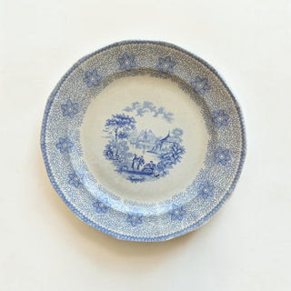 Her Good Eye vintage porcelain dinner plate with blue and white pastoral transferware scene and floral border